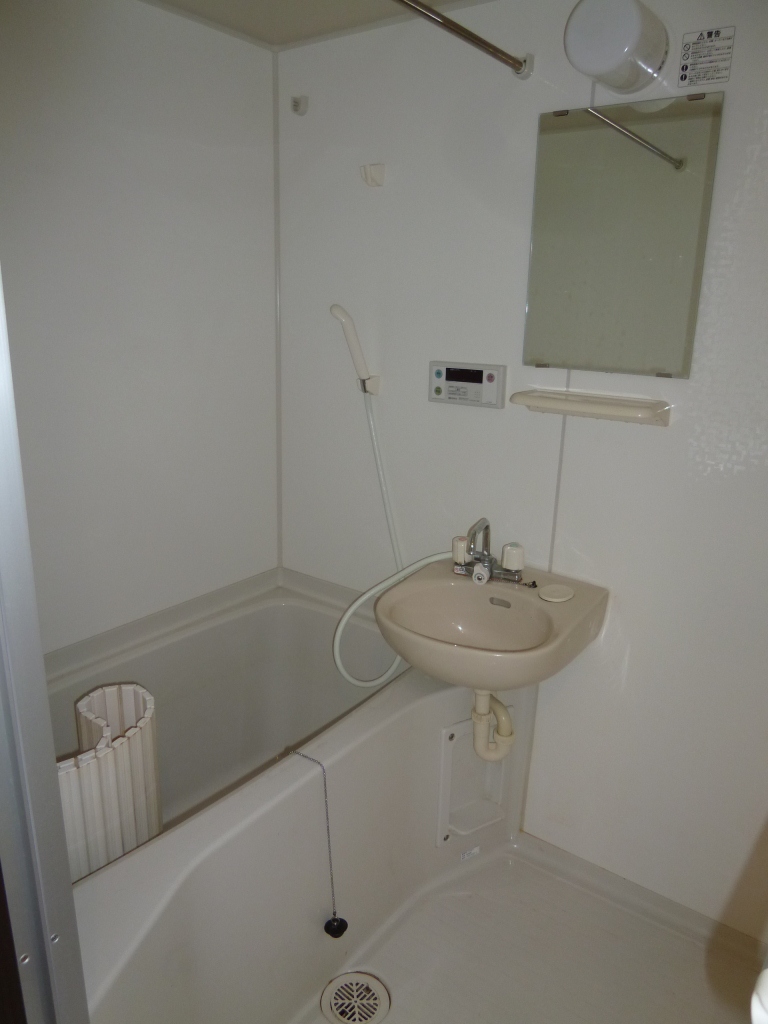 Bath. It is a photograph of the same type of room.