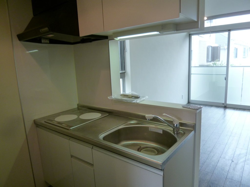 Kitchen. It is a photograph of the same type of room.