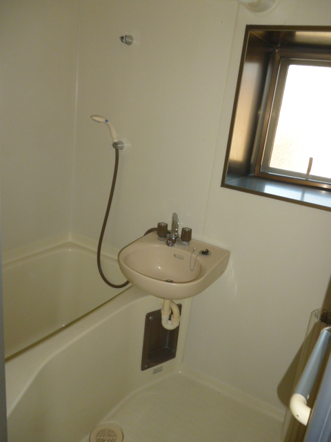 Toilet. There is a window in the bath