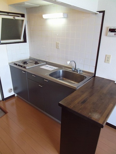 Kitchen. There is a window in the kitchen next to