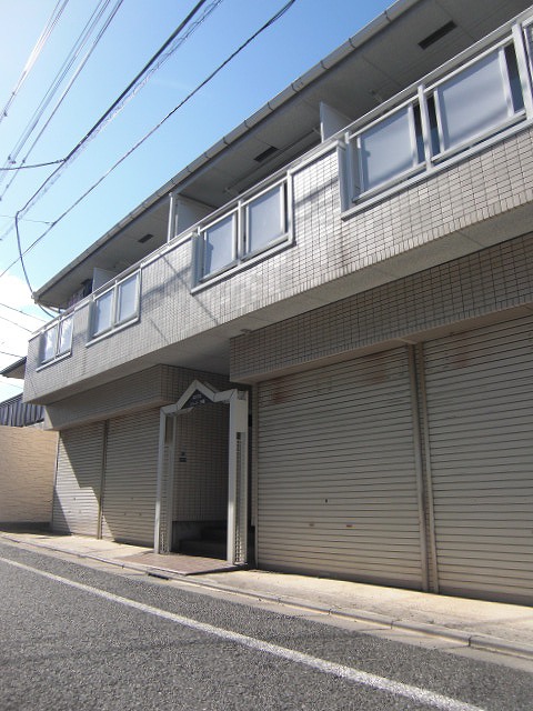 Building appearance. The shutter is parking.