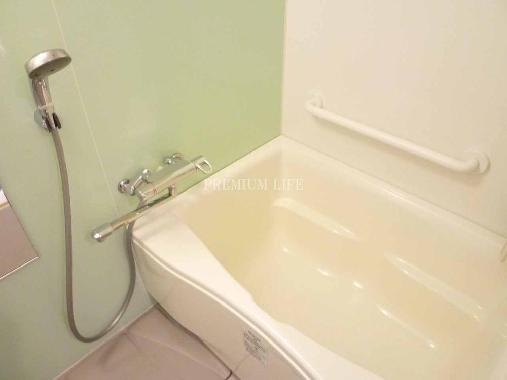 Bathroom.  [bathroom] Bathroom with handrail.