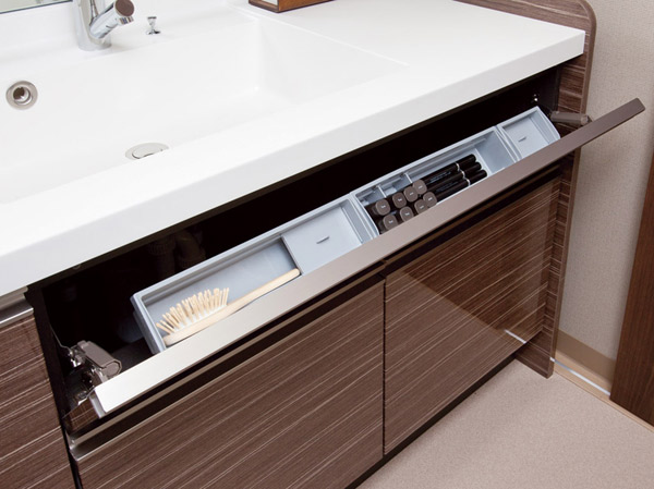 Bathing-wash room.  [Pocket storage] To wash the bowl before the space, Is functionality rich specifications provided with a convenient pocket housed in the housing, such as cosmetics.