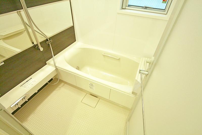 Bathroom. It is a bathroom with wide mirror