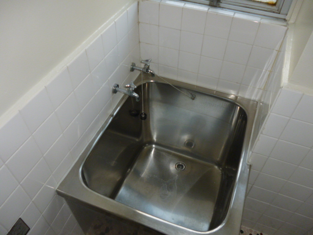 Bath. There is a window in the bath.