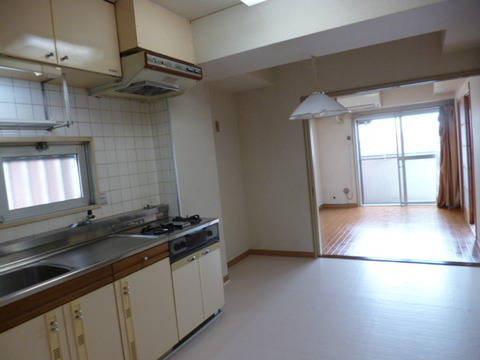Living and room. The window is there in the kitchen.