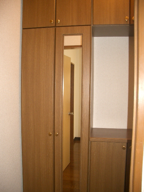 Entrance. Plenty of storage shoebox