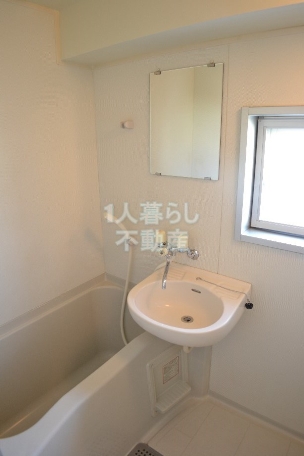 Bath. There is a window in the bath