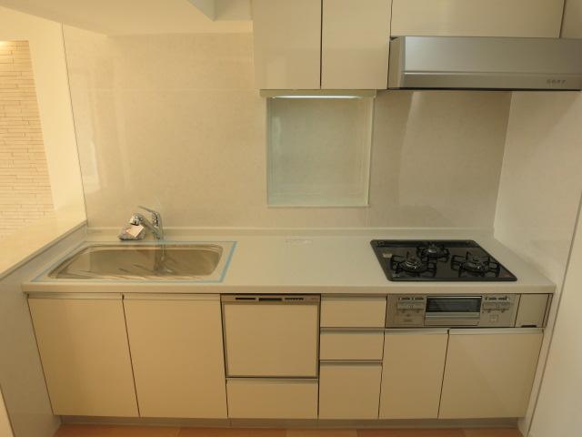 Kitchen. Walk-through type of kitchen will come in handy at the time of visitor.