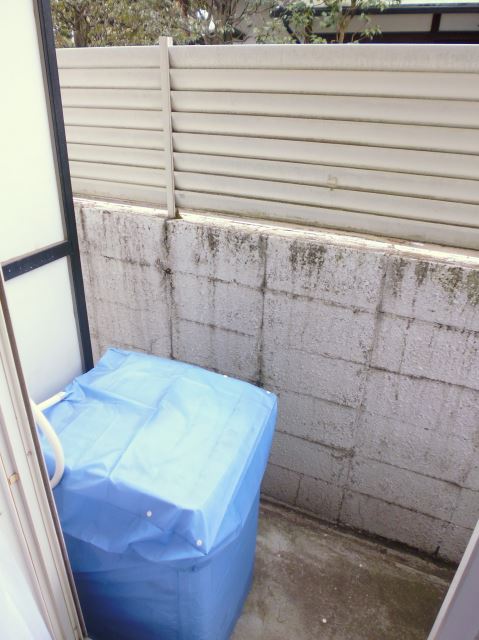 Balcony. There is also a washing machine.