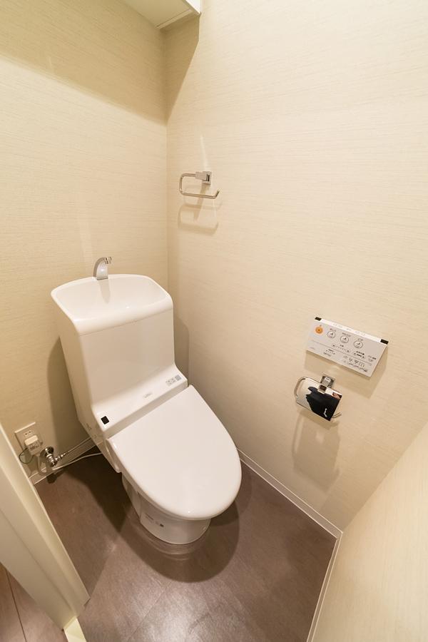 Toilet. TOTO made cleaning toilet seat with toilet