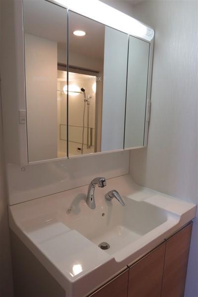 Wash basin, toilet. With happy shower in a busy morning