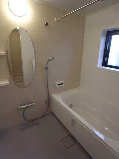 Bathroom. The bathroom is decorated in a clean.