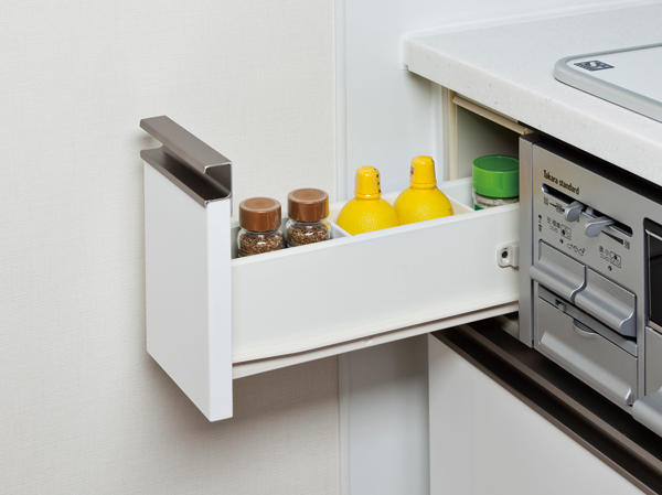 Kitchen.  [Spice rack] Adopt a spice rack that can be functionally housed together seasoning. It is one of the consideration to the cooking space and neat.