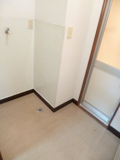 Other room space. Washing machine in the room