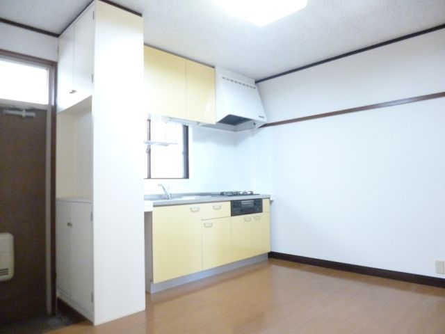 Living and room. Room is a kitchen