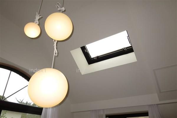 Living. Light plugs into the skylight in the living