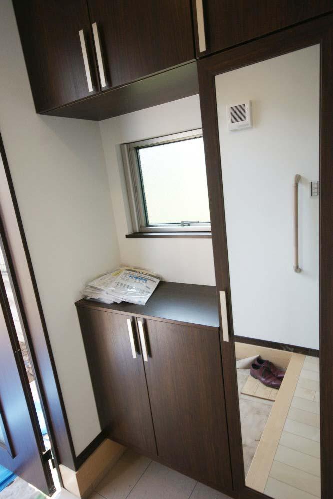 Entrance. Mirror attached to the cupboard will come in handy when you go out