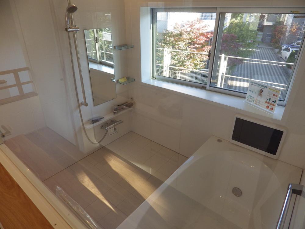 Bathroom. It is a bathroom with TV where light is plugged