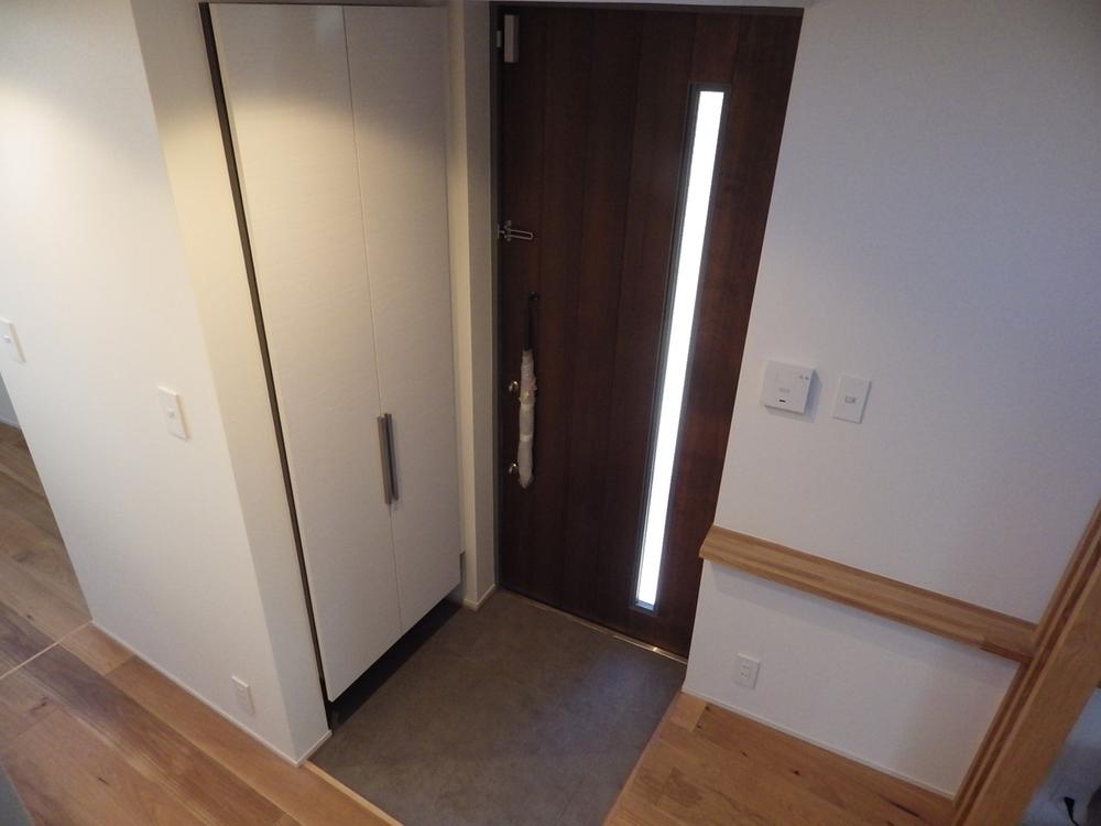 Entrance. Calm entrance space provided with a portrait of the storage