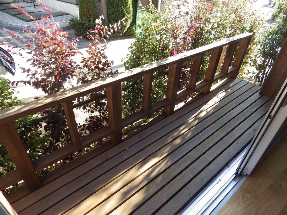 Balcony. Wood deck balcony that leads to the first floor of the living room
