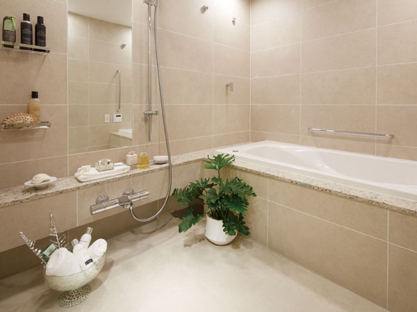 Bathing-wash room.  [bathroom] High thermal insulation artificial marble tub, Long-lasting even warmth in the cold winter, We established a handrail to support the operation in the bathtub. Further use of the counter-top plate of luxurious natural stone (granite). Vertical mirror of embedding is your easy-care structure in the tile surface and the flat.