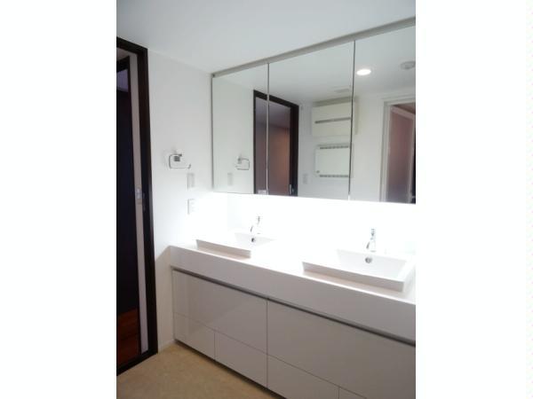 Wash basin, toilet. Clean full of vanity space.