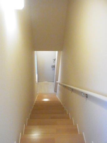 Other room space. Staircase with a handrail.