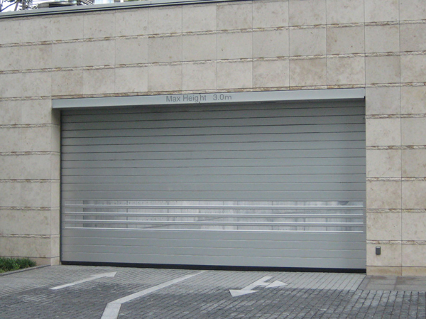 Security.  [Spiral shutter (high-speed shutter)] The parking lot entrance, Installing a spiral shutter to be open the shutter by remote control operation. A few seconds later when the car passes through the gate shutter is closed automatically, Suppress the trespassing.