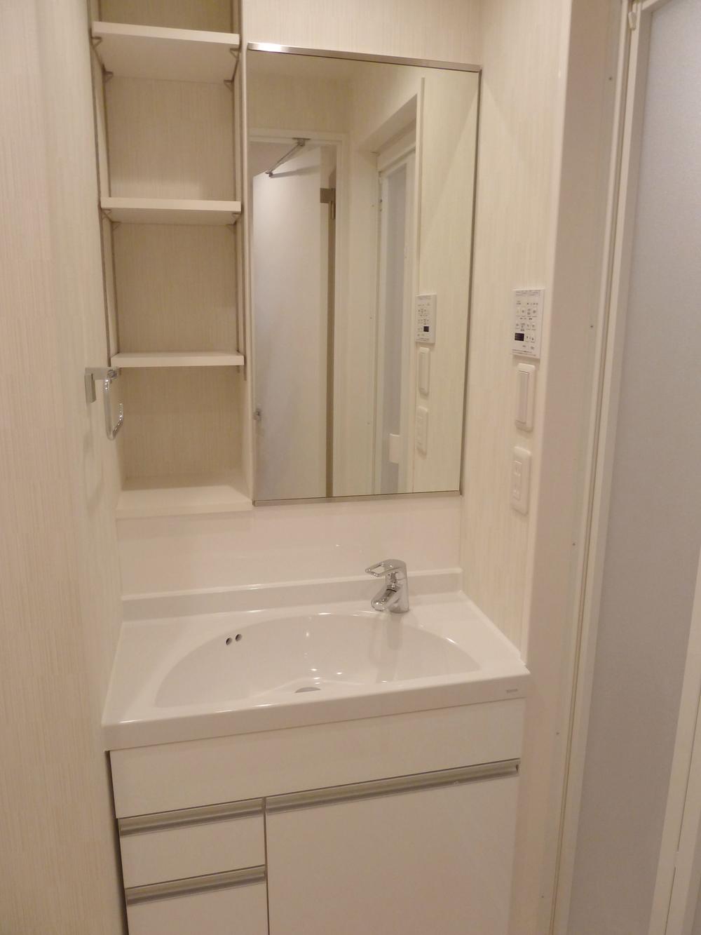 Wash basin, toilet. Bathroom vanity