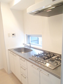 Kitchen. System kitchen of 4-neck gas stove with a small window