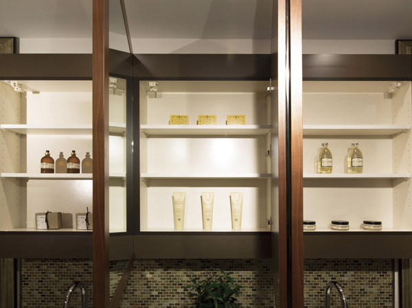 Bathing-wash room.  [Housed with three-sided mirror vanity] With storage for small items such fits neat on the back of the three-sided mirror. The center of the mirror is with defogging.