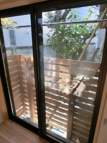 Balcony. The outside of the windows overlooking the lemon tree.