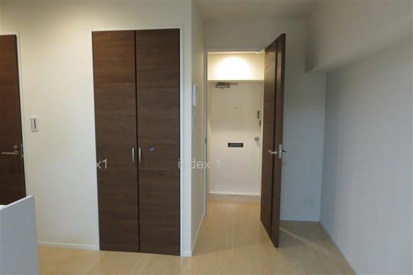 Living. The left side of the door is the Laundry Area