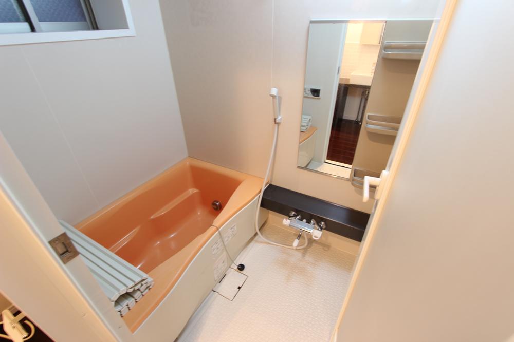 Bathroom. Corner is a room with a window in the bathroom