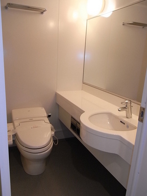 Washroom. Large vanity and hot water cleaning function heating toilet seat