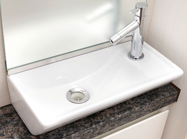 Bathing-wash room.  [Natural stone counter] Toilet in the restroom counter has adopted a granite with a profound feeling.  ※ Different shape by type.