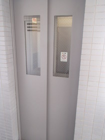 Other common areas. Elevator with security window