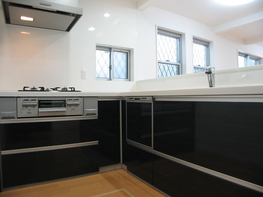 Kitchen. Tableware is washing machine with.