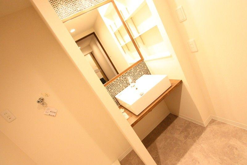 Wash basin, toilet. Wash basin was finished with mosaic tile specification