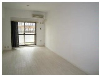 Living and room. It is a photograph of the other room. 