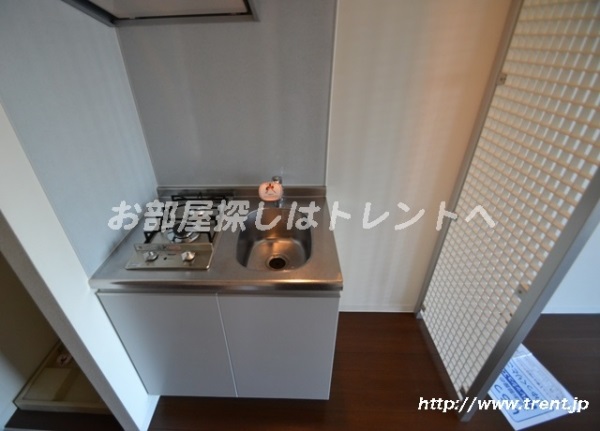 Kitchen. It is a photograph of the same building 1K. Please see for reference.