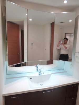 Washroom. Three-sided mirror large washbasin