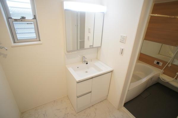 Wash basin, toilet. B Building wash room