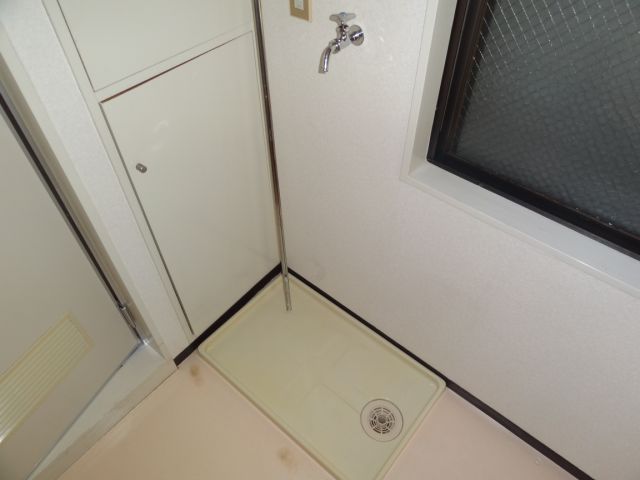 Other room space. Washing machine in the room