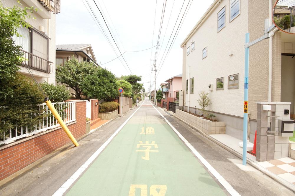 Local photos, including front road. Green is rich in a quiet residential area