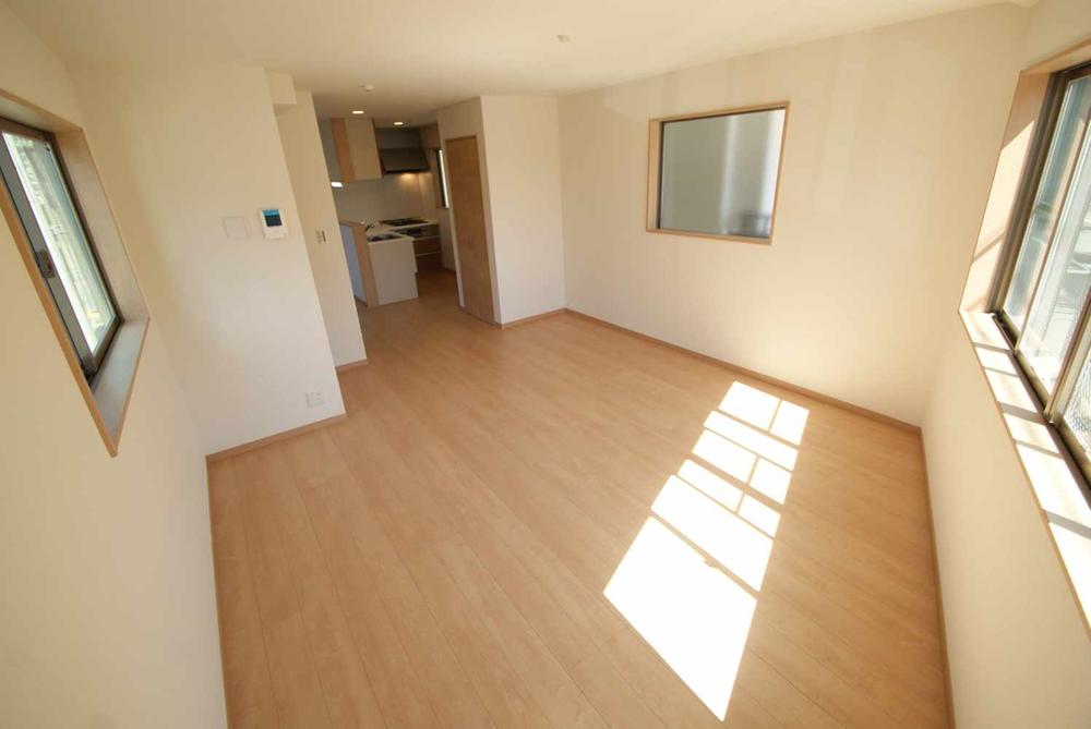 Living. It is a sunny living room facing south-facing.