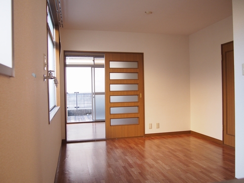 Other room space. Washing machine in the room.