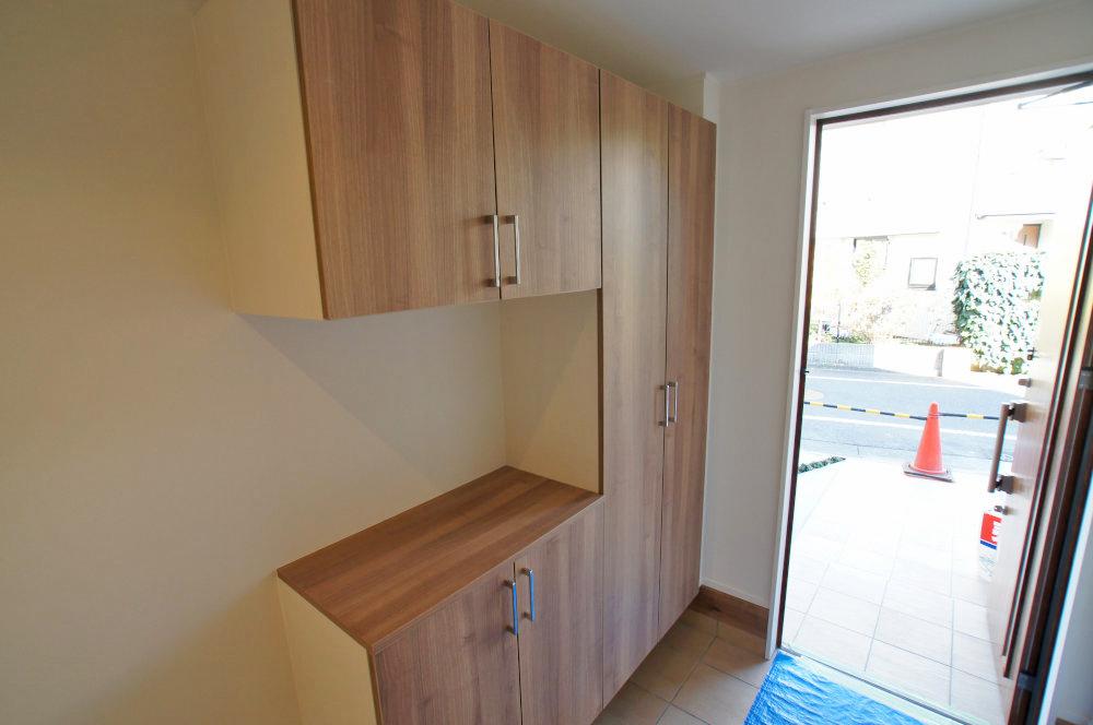 Entrance. It will be at the door. Please leave the storage of shoes.