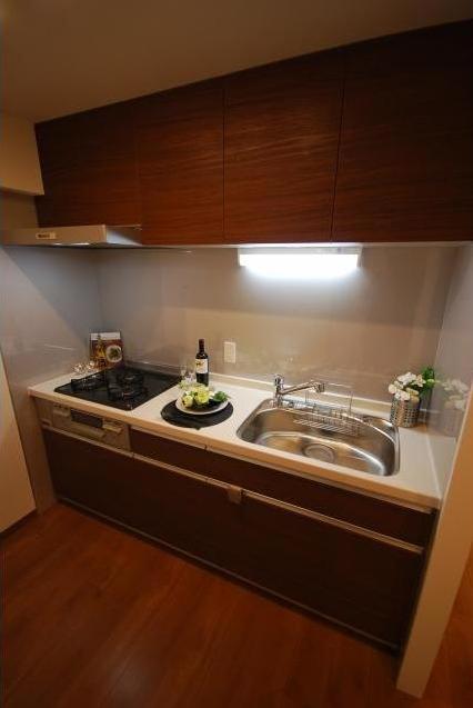 Kitchen. Stylish system kitchen to match the atmosphere of the room